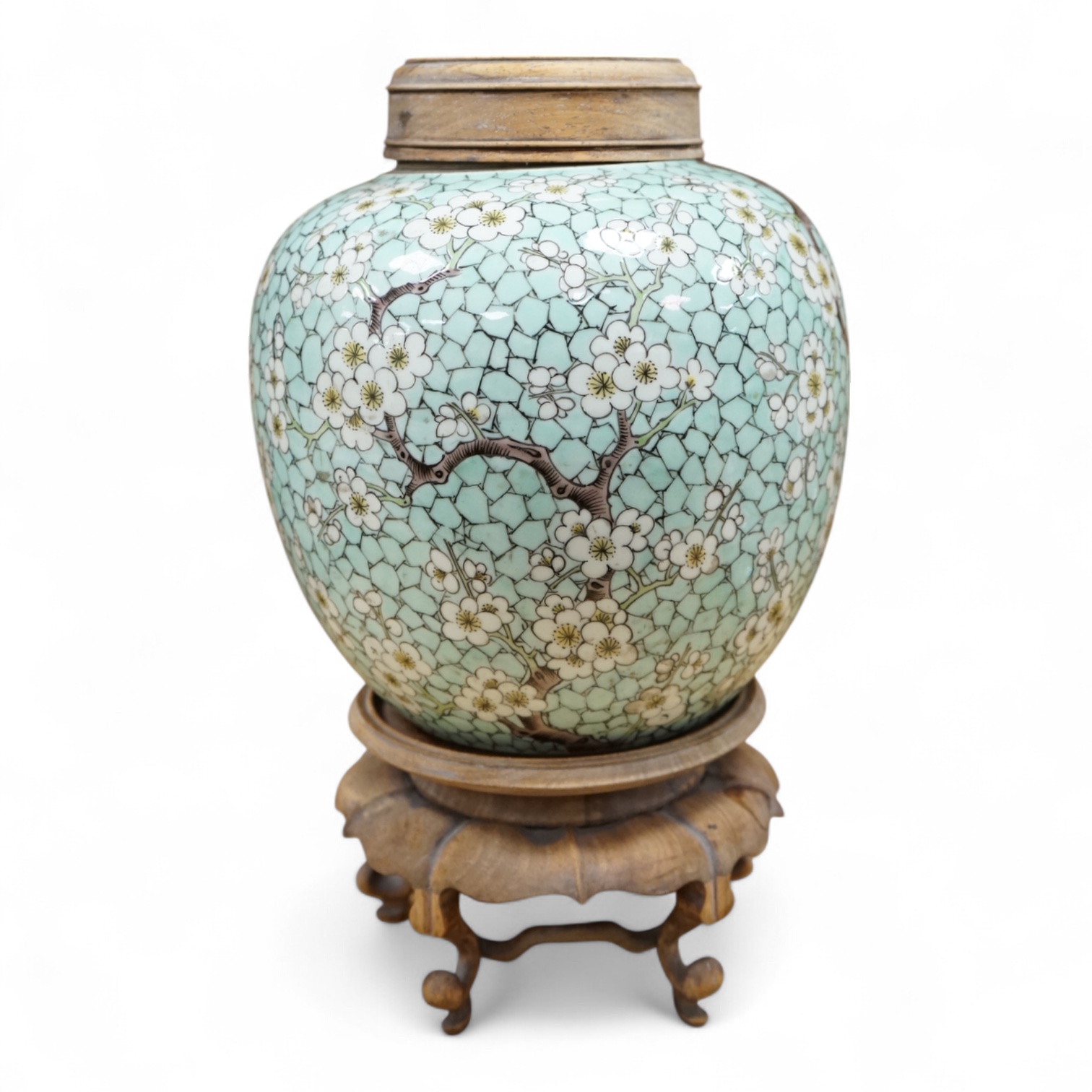 A Chinese famille verte enamelled prunus jar, 19th century, with wood cover and stand, 25cm high